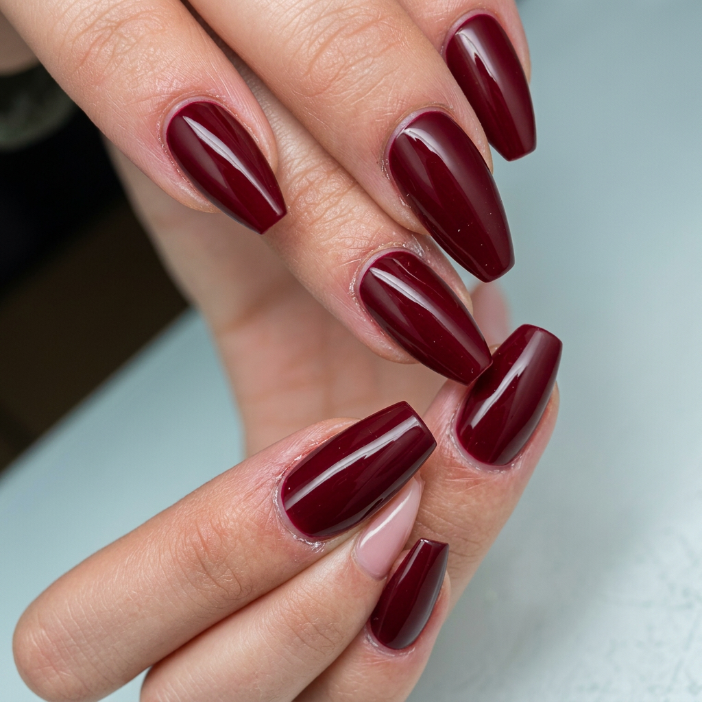 Deep burgundy glossy gel nails
